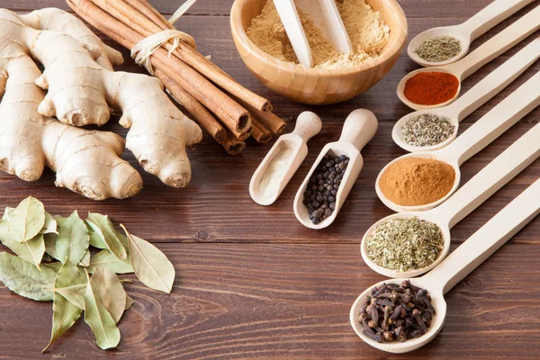 Spice assortment on a wooden table — Stock Photo, Image