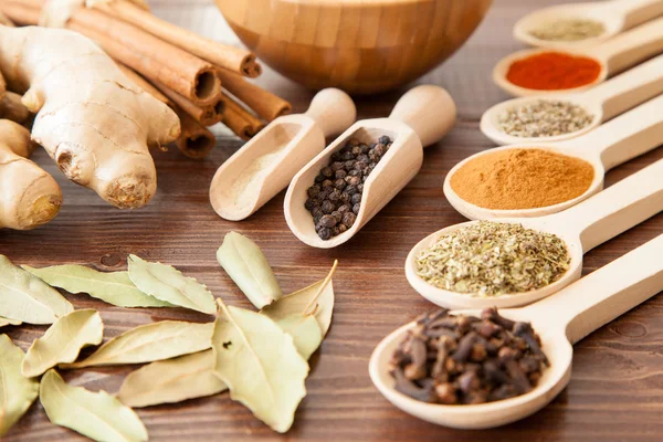 Spice assortment on a wooden table — Stock Photo, Image