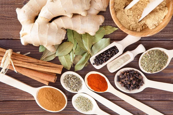 Spice assortment on a wooden table — Stock Photo, Image