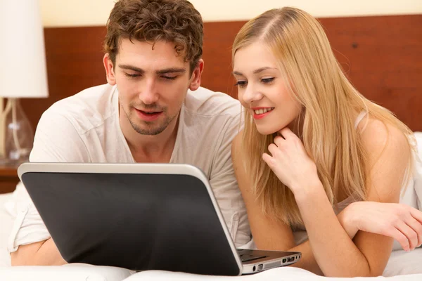 Young couple in bed — Stock Photo, Image