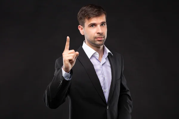 Young businessman in a black suit — Stock Photo, Image