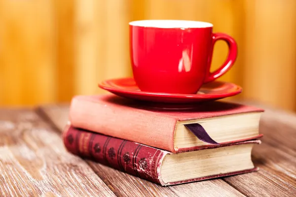 Books and a coffee cup — Stock Photo, Image