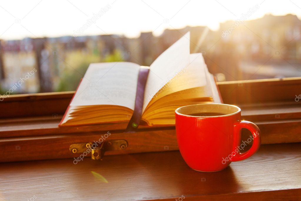 Books and a coffee cup Stock Photo by ©gdolgikh 48134997