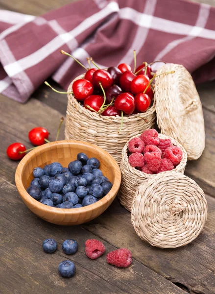 Fresh berries on a wooden table — Stock Photo, Image