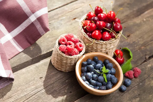 Fresh berries on a wooden table — Stock Photo, Image