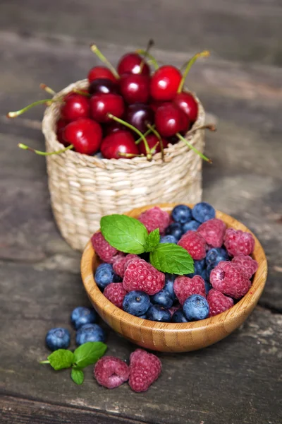 Fresh berries on a wooden table — Stock Photo, Image