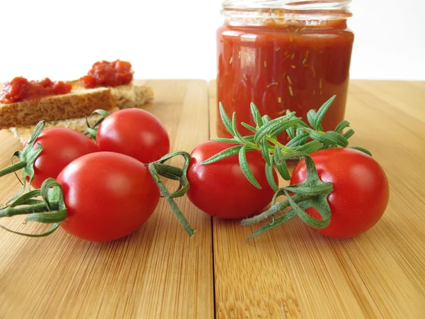 Tomato jam with rosemary — Stock Photo, Image
