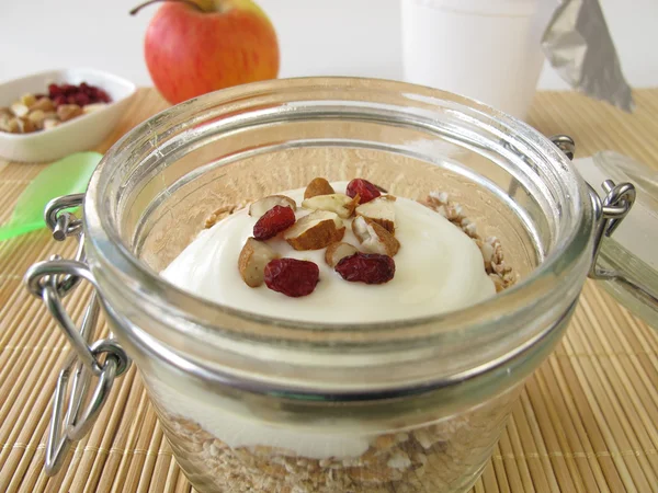 Shake muesli with yogurt in a jar — Stock Photo, Image