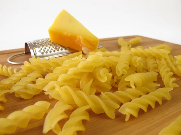 Pasta with small grater and cheese — Stock Photo, Image