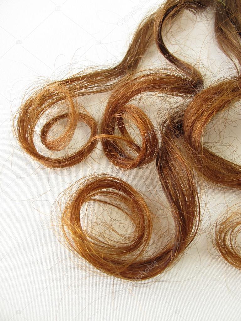 Genuine chestnut-brown hair curls