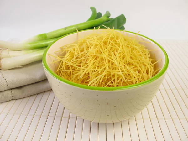 Small soup noodles and spring onions — Stock Photo, Image