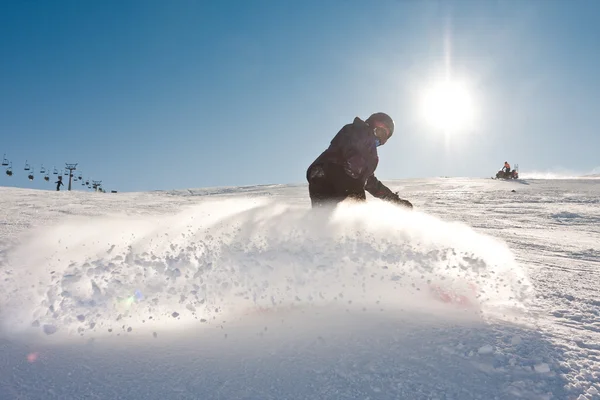 Young man snowboarding — Stock Photo, Image