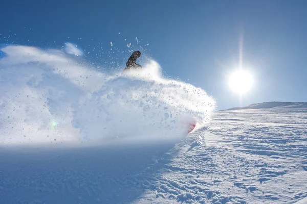 Young man snowboarding Royalty Free Stock Images