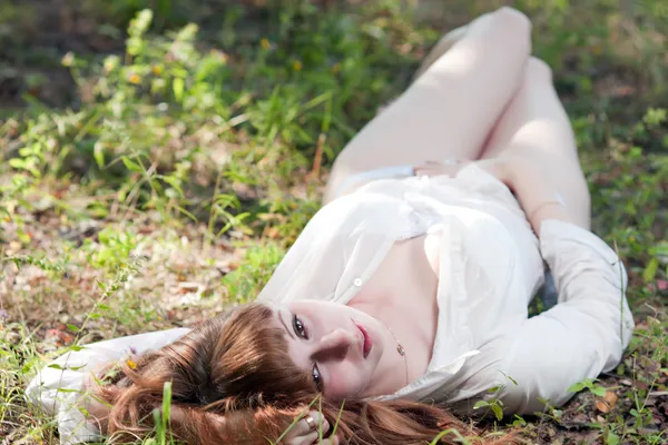 The woman on a grass in underwear — Stock Photo, Image