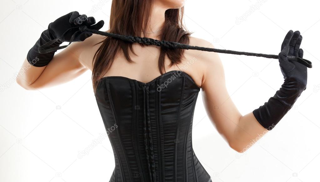 woman in a corset and riding crop