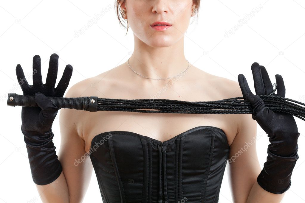 Woman in a corset and whip