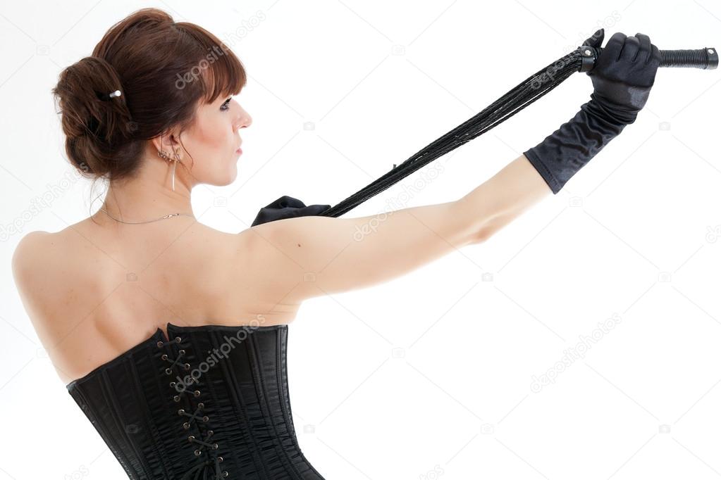 woman in a corset and whip