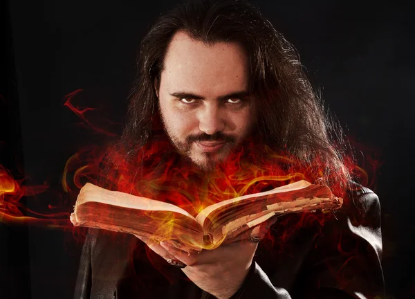 The man with burning book — Stock Photo, Image
