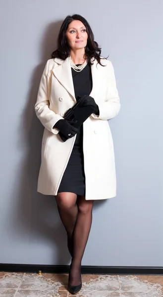 Business woman in a white coat — Stock Photo, Image