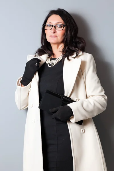 Business woman in coat and glasses — Stock Photo, Image