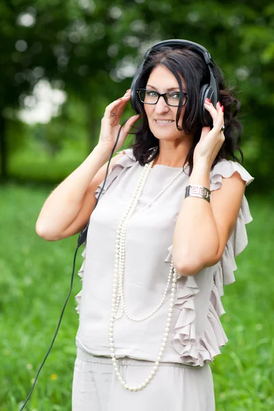 Adult woman in headphones — Stock Photo, Image