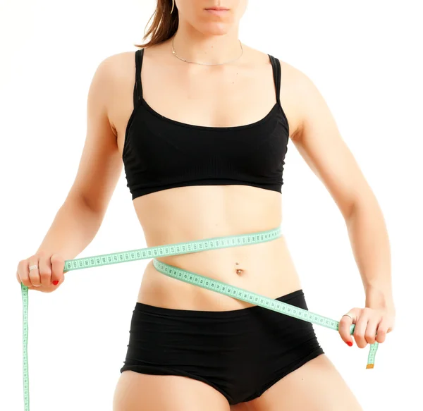 Sportovní žena s měřicí pásky — Stock fotografie