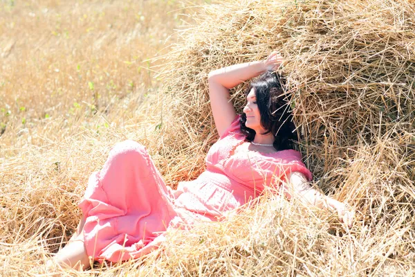 Woman in hay — Stock Photo, Image