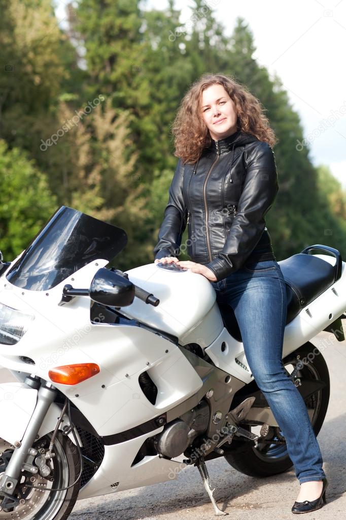 woman sitting on a motorcycle