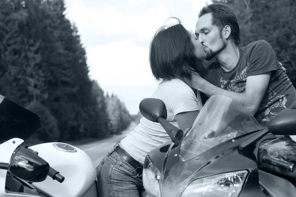 Man and woman on motorcycles