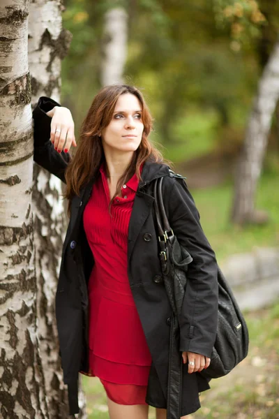 Woman standing near birch — Stock Photo, Image