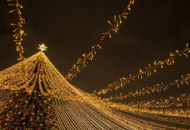 beautiful new year decorations on the christmas tree at night