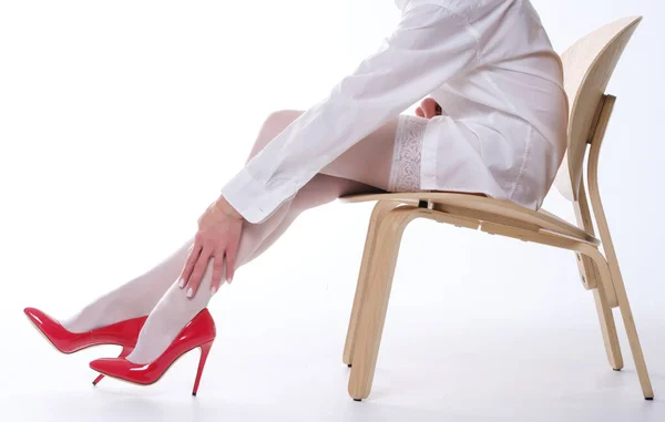 Woman Beautiful Legs White Stockings Red Shoes Sits Chair White — Stock Photo, Image