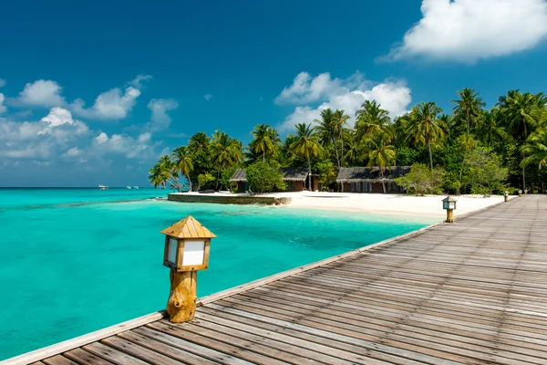 Jetty to a tropical beach — Stock Photo, Image