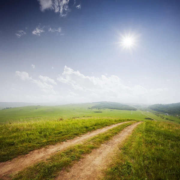 Rural road and the blue sky — Φωτογραφία Αρχείου