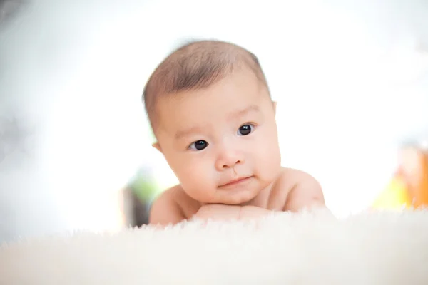 Cute baby lie on bed — Stock Photo, Image