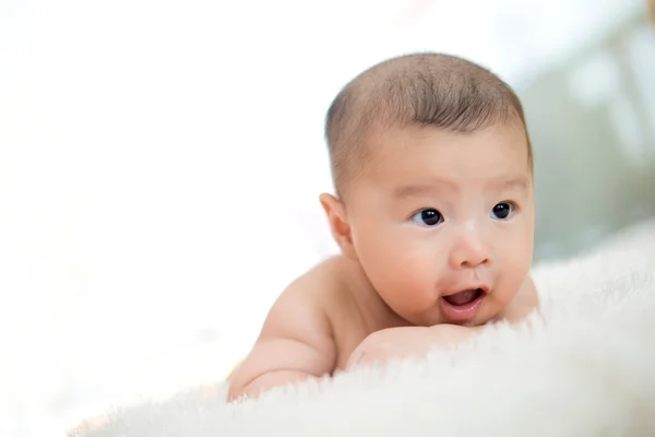 Cute baby lie on bed — Stock Photo, Image