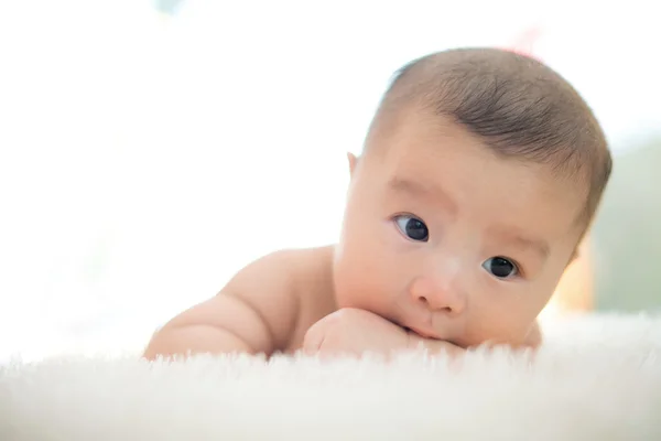 Cute baby lie on bed — Stock Photo, Image