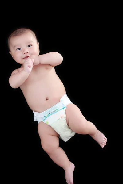 Aranyos ázsiai baba fekete háttér — Stock Fotó