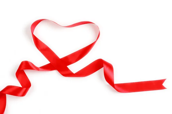 Shiny red satin ribbon with heart shape on white background with copy space. Macro with extremely shallow dof. — Stock Photo, Image