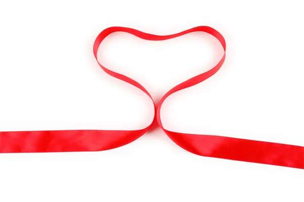 Shiny red satin ribbon with heart shape on white background with copy space. Macro with extremely shallow dof. — Stock Photo, Image