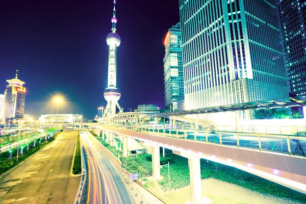 The light trails on the modern building background — Stock Photo, Image