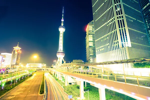 The light trails on the modern building background — Stock Photo, Image