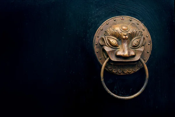 antique oriental door knocker