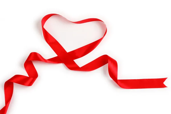 Red ribbon forming heart — Stock Photo, Image