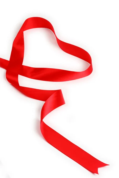 Red ribbon forming heart — Stock Photo, Image