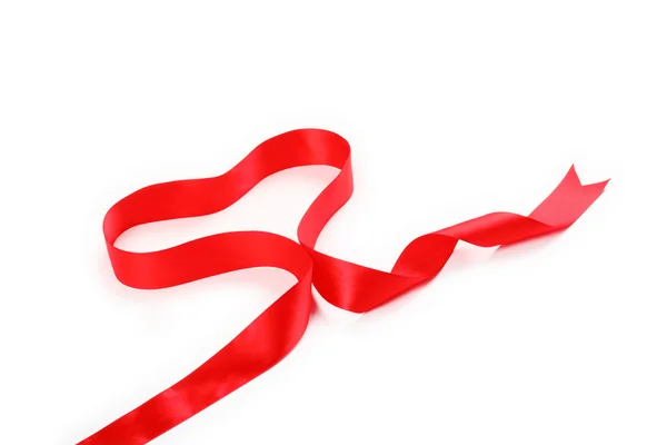 Red ribbon forming heart — Stock Photo, Image