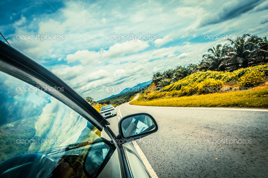 Speed car driving at high speed on empty road motion blur — Stock