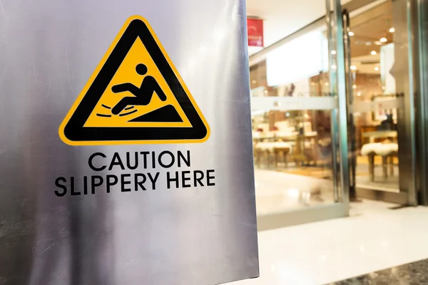 Caution sign at store — Stock Photo, Image