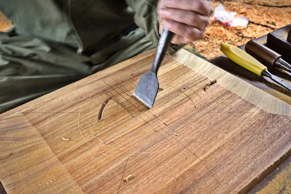 Carpenter with chisel and hammer — Stock Photo, Image