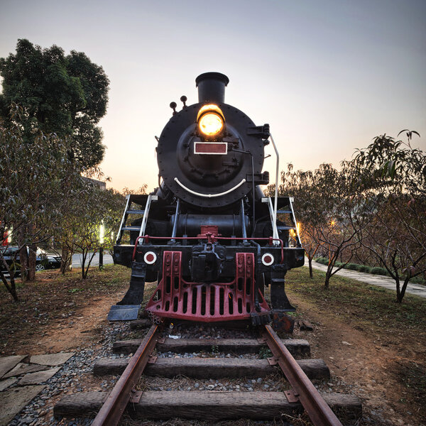 Vintage Steam Engine train with sunset